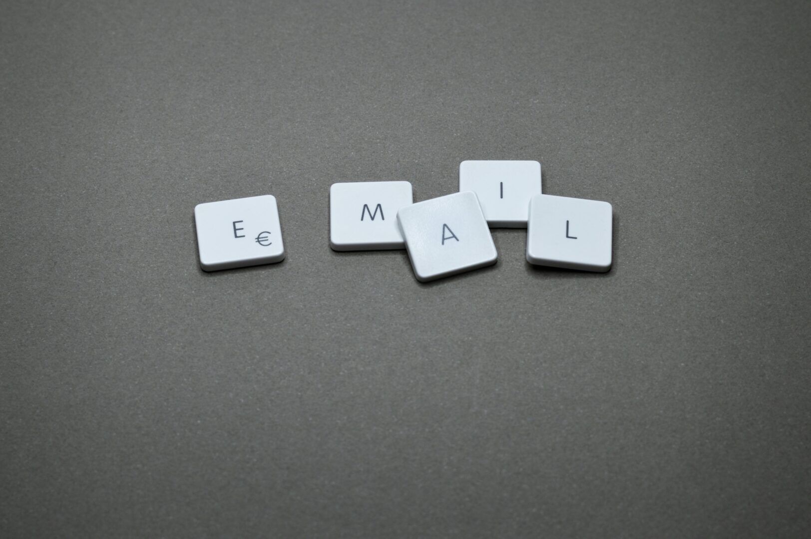 a group of white square tiles with letters on them